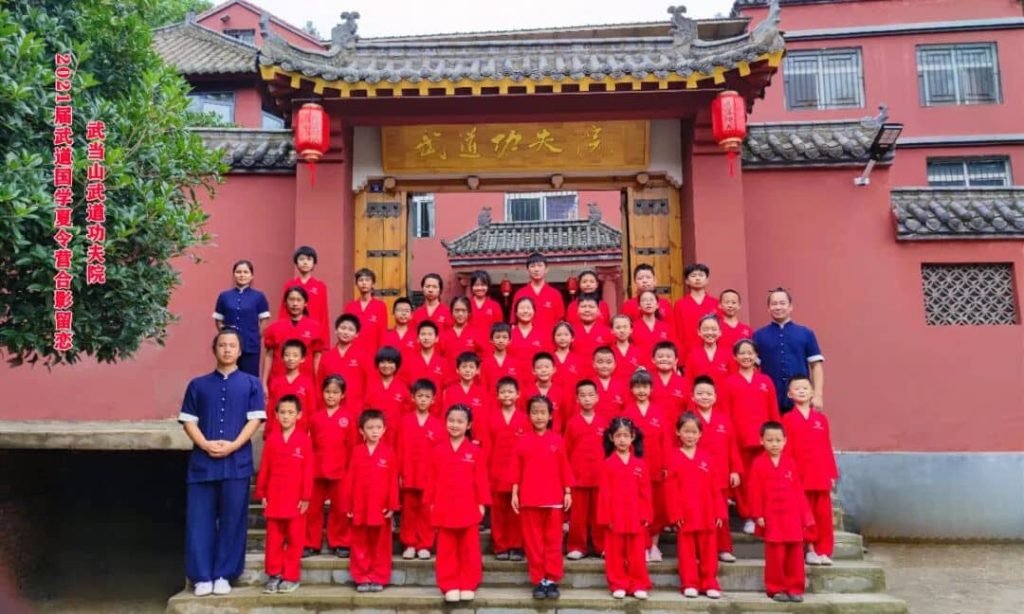 image shows students taking a picture during the Chinese martial arts summer camp