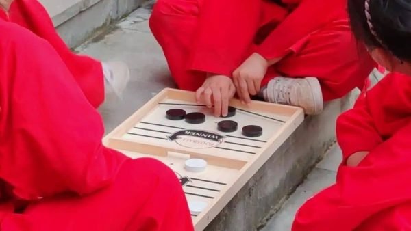 image shows students playing, slingshot puck