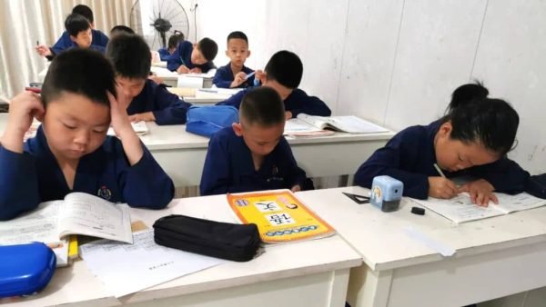 image shows students learning taoist health preservation techniques