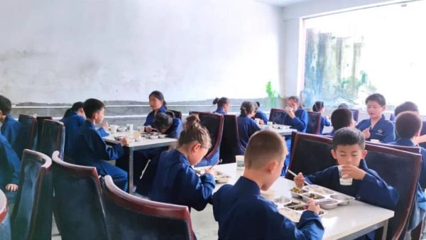 image shows students eating at the cafeteria of Wudang Kung Fu Academy