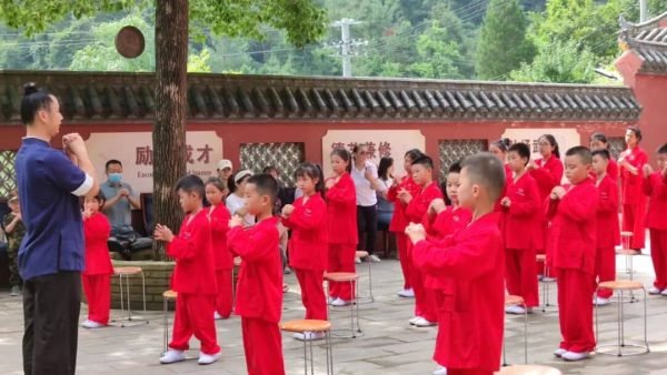 image shows young disciples learning taoist health preservation methods