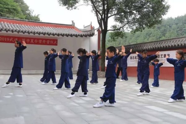 students learning kung fu in the courtyard of wudang kungfu academy