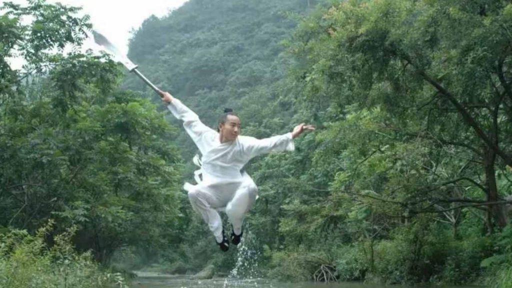 image shows master qingfengzi performing wudang kung fu weapons